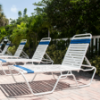 C160 - St. Maarten II Elevated Stackable Vinyl Strap Chaise Lounge with 16" Seat Height - Lifestyle
