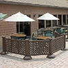 Brown resin lattice patio fencing installed around outdoor restaurant dining area with umbrellas and tables