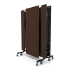 folding cafeteria table with walnut top stored vertically with bench seating and rolling steel frame