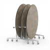 multiple 60 inch round folding cafeteria tables nested on storage cart with laminate tops and steel frames