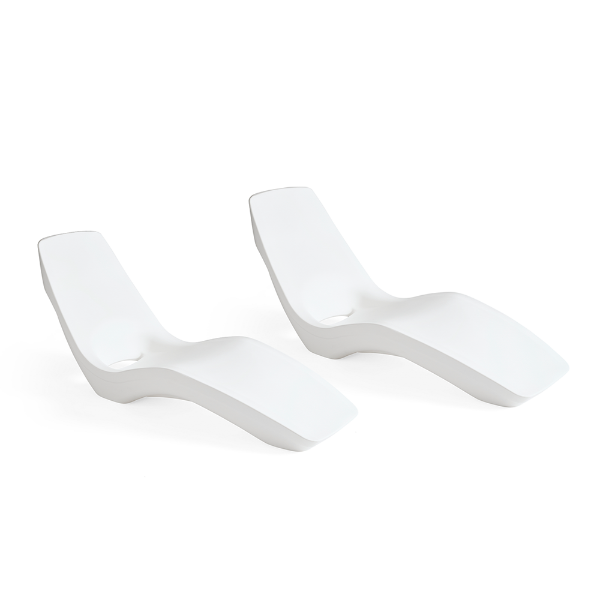 Two white Forma luxury in-pool chaise lounges with ergonomic contoured design