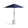 Forma in-pool hospitality side table supporting a commercial patio umbrella
