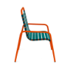 Side view of Sundance commercial outdoor dining chair with Orange Burst aluminum frame and Teal vinyl strap seat and back