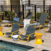 Sundance cross-weave commercial outdoor sand chairs with yellow aluminum frames and gray woven vinyl seating arranged beside a swimming pool