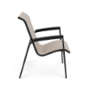 Side view of Skyline commercial dining chair with Cane Oyster sling fabric, Starlight Black aluminum frame, and matching MGP arm caps