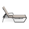 Side view of Skyline commercial chaise lounge with Cane Oyster sling fabric, Starlight Black aluminum frame, and adjustable backrest
