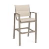 A three-quarter front view of an elevated commercial outdoor bar chair featuring a satin amber aluminum frame and double-layer padded Cane Oyster sling seating.