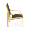 Side profile view of an outdoor dining chair featuring a bright yellow metal frame and dark gray metallic sling seating.