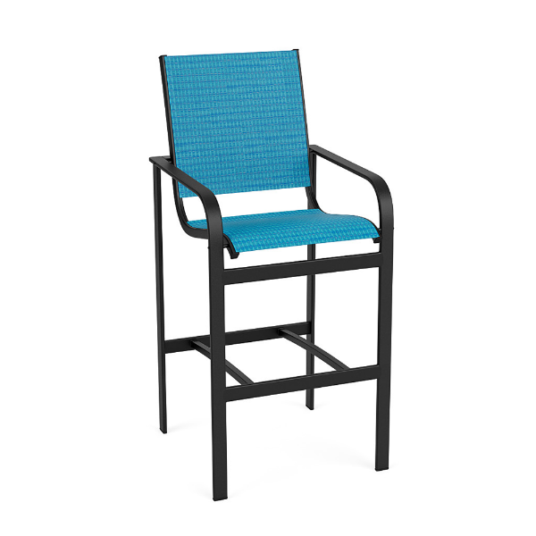 Three-quarter front view of an elevated outdoor bar stool featuring a textured charcoal aluminum frame and bright blue sling fabric seating