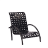 Three-quarter front view of a low-profile commercial outdoor sand chair featuring curved armrests, an aluminum frame in black, and a black vinyl cross-weave strap seat and backrest.