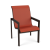 Three-quarter front view of a modern outdoor commercial patio dining chair with a dark Coffee Bean brown aluminum frame and a vibrant rust-red Metallica Salsa fabric sling.