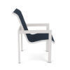 Side profile view of a commercial outdoor dining arm chair featuring a powder-coated Sky White aluminum frame with square armrests and a dark navy blue Dupione Sapphire fabric sling seat and backrest.
