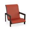 Three-quarter front perspective view of a modern low-profile outdoor beach or poolside sand chair with a dark Coffee Bean brown frame and a vibrant rust-red Metallica Salsa fabric sling.