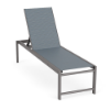 High-angle perspective view of an ADA-accessible commercial poolside chaise lounge with an adjustable backrest, a Titanium Gray metallic aluminum frame, and a slate blue Kozo Jewel textured sling.