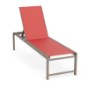 High-angle perspective view of an elevated ADA height outdoor lounge chair with a beige Satin Amber aluminum frame and a bright coral pink Straw Mat textured sling.