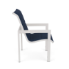 Side profile view of a commercial outdoor dining armchair featuring a powder-coated Sky White aluminum frame, straight armrests, and a dark navy blue Dupione Sapphire padded sling seat and backrest.