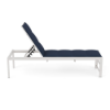 Side view profile of an ADA accessible commercial outdoor chaise lounge featuring an elevated Sky White aluminum frame with an adjustable backrest and a dark navy blue Dupione Sapphire padded sling seat.