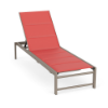 Three-quarter view of an outdoor pool deck chaise lounge featuring a warm beige Satin Amber frame paired with a coral red Straw Mat padded sling seat.