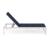Side view profile of a commercial outdoor pool deck chaise lounge featuring a Sky White powder-coated aluminum frame and a dark navy blue Dupione Sapphire padded sling seat.