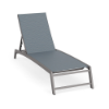 Front three-quarter perspective view of an adjustable commercial chaise lounge featuring angled Titanium Gray aluminum legs and a slate blue Kozo Jewel sling fabric seat.