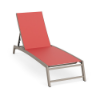Front perspective view of an outdoor pool deck chaise lounge featuring a warm beige Satin Amber frame and a bright coral red Straw Mat fabric sling.