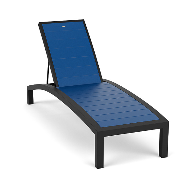 A front three-quarter perspective view of a commercial poolside lounge chair with a dark Textured Charcoal aluminum frame and bright Royal Blue Marine Grade Polymer (MGP) slatted surface.