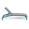 A side profile view of an adjustable commercial pool chaise lounge with a vibrant teal Metallica Lagoon powder-coated aluminum frame and a multi-toned textured Blazer Confetti padded sling fabric.
