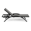 A side profile view of an adjustable commercial pool deck chaise lounge featuring a dark Textured Charcoal arched aluminum frame and neutral Grey Marine Grade Polymer (MGP) slatted seating.