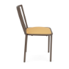 A side profile view of a commercial outdoor dining chair featuring a dark Textured Espresso powder-coated frame with vertical back spindles and a bright yellow-gold Canary padded cushion.