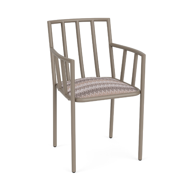 A front three-quarter view of a commercial outdoor dining armchair featuring a taupe Satin Amber aluminum frame with integrated arms and a multi-toned, zig-zag patterned Valley Dune cushioned seat.