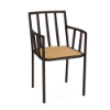 A front three-quarter view of a commercial outdoor dining armchair with vertical slat backrest and arm details, a dark Coffee Bean aluminum frame, and a golden tan cushioned seat.