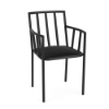A front three-quarter perspective of an all-black commercial patio dining armchair featuring a black aluminum frame, vertical slatted armrests and backrest, and a solid Starlight Black seat cushion.