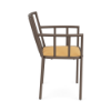 A side profile view of a commercial outdoor dining armchair with a dark Textured Espresso powder-coated frame, vertical arm and back spindles, and a bright yellow-gold Canary padded cushion.