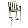 A front three-quarter view of a commercial outdoor bar armchair designed with a tall Coffee Bean powder-coated aluminum frame, slatted armrests and backrest, lower perimeter footrest, and a golden tan cushioned seat.