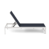 A side profile view of an armless commercial outdoor chaise lounge featuring a sleek Sky White powder-coated square aluminum frame, an adjustable ratcheting recline mechanism, and deep navy blue Dupioni Sapphire sling fabric.