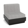 A front three-quarter view studio product shot of an armless commercial outdoor lounge chair featuring a dark Black Granite Marine Grade Polymer (MGP) platform base with an upholstered, plush light gray outdoor fabric cushion.