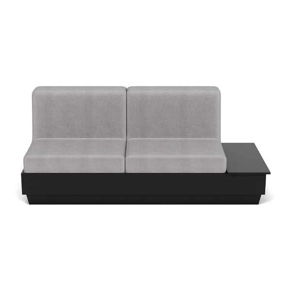 A straight-on front studio product shot of a commercial outdoor sofa featuring a Black Granite Marine Grade Polymer (MGP) platform base with an integrated side table surface on the left side and thick light gray outdoor fabric cushions.
