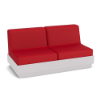 A front three-quarter view studio product shot of an armless commercial outdoor sofa featuring a White Marine Grade Polymer (MGP) platform base and bold Logo Red upholstered cushions.