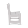 Side profile view showing the slatted back and frame construction of the white Leisure MGP outdoor dining chair.