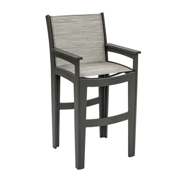 Front three-quarter view of the Leisure MGP Sling outdoor bar chair featuring a dark grey Fossil Grey frame with built-in footrest and a textured Kozo patterned fabric sling seat.