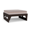 Front perspective view of a commercial outdoor ottoman featuring a dark espresso MGP base paired with a geometric patterned cushion in earth-toned dune shades.