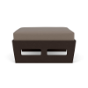 Side profile view of a commercial outdoor ottoman with a dark espresso brown woodgrain MGP frame and a neutral taupe cushioned top.