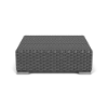 Three-quarter elevated perspective view of a square commercial coffee table wrapped in woven dark gray weather-resistant wicker featuring square silver corner feet.