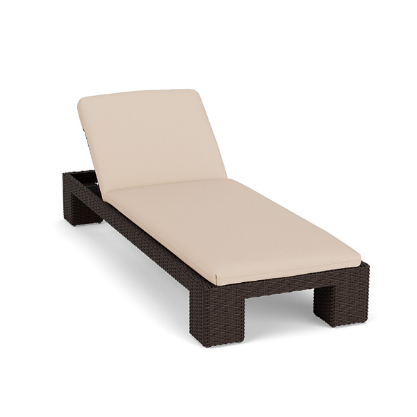 Three-quarter elevated perspective view of an adjustable commercial outdoor chaise lounge with a dark chocolate brown resin wicker base and a light beige full-length cushion.