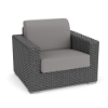 Three-quarter perspective view of a commercial outdoor deep-seating lounge chair made of dark gray Highland resin wicker with medium gray seat and back cushions.