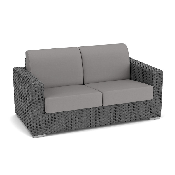 Three-quarter perspective view of a commercial outdoor deep-seating loveseat made with dark gray Highland resin wicker and medium gray seat and back cushions.