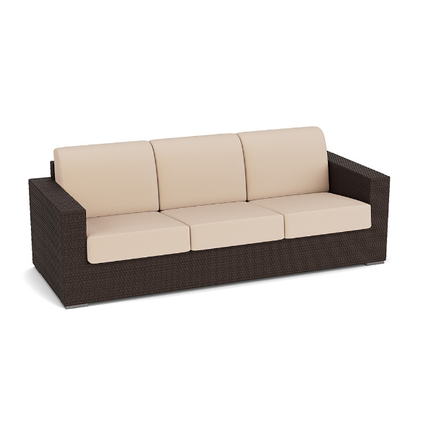 Three-quarter perspective view of a three-seat commercial outdoor sofa made of dark brown Java Chocolate resin wicker with neutral off-white/beige seat and back cushions.
