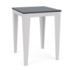 Three-quarter perspective view of a 30-inch square MGP outdoor bar-height table featuring a navy blue slatted tabletop set on a crisp white frame and tapered legs.