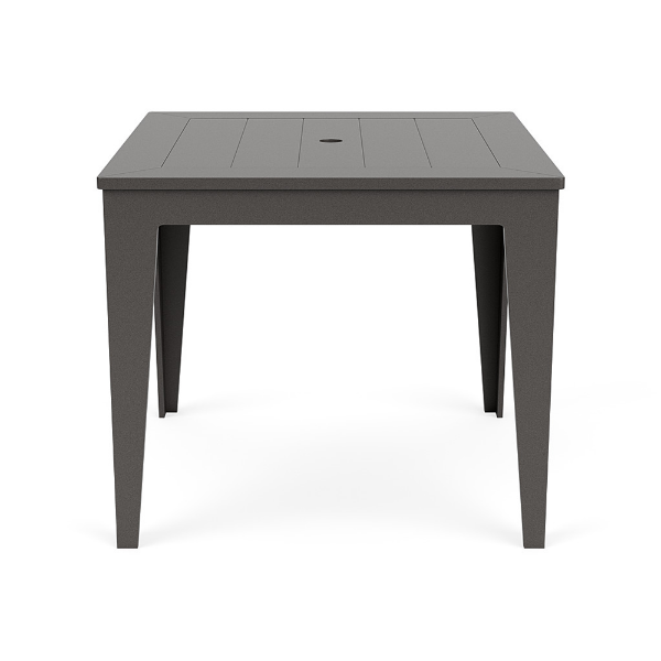 Straight-on front view of a 36-inch square MGP outdoor dining-height table featuring a uniform dark grey finish on both the slatted top (with a centered umbrella hole) and the tapered legs
