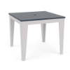 Three-quarter perspective view of a 36-inch square MGP outdoor dining-height table featuring a navy blue slatted top with a centered umbrella hole, set on a white frame with tapered legs.